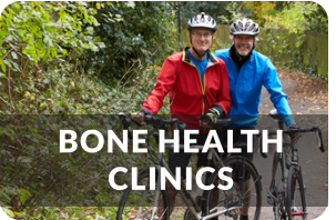 A senior couple stands next to bicycles on a path in the woods. Title reads: Bone Health Clinic
